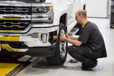 Technician performing a 41-point inspection at Karl Chevrolet of Stuart
