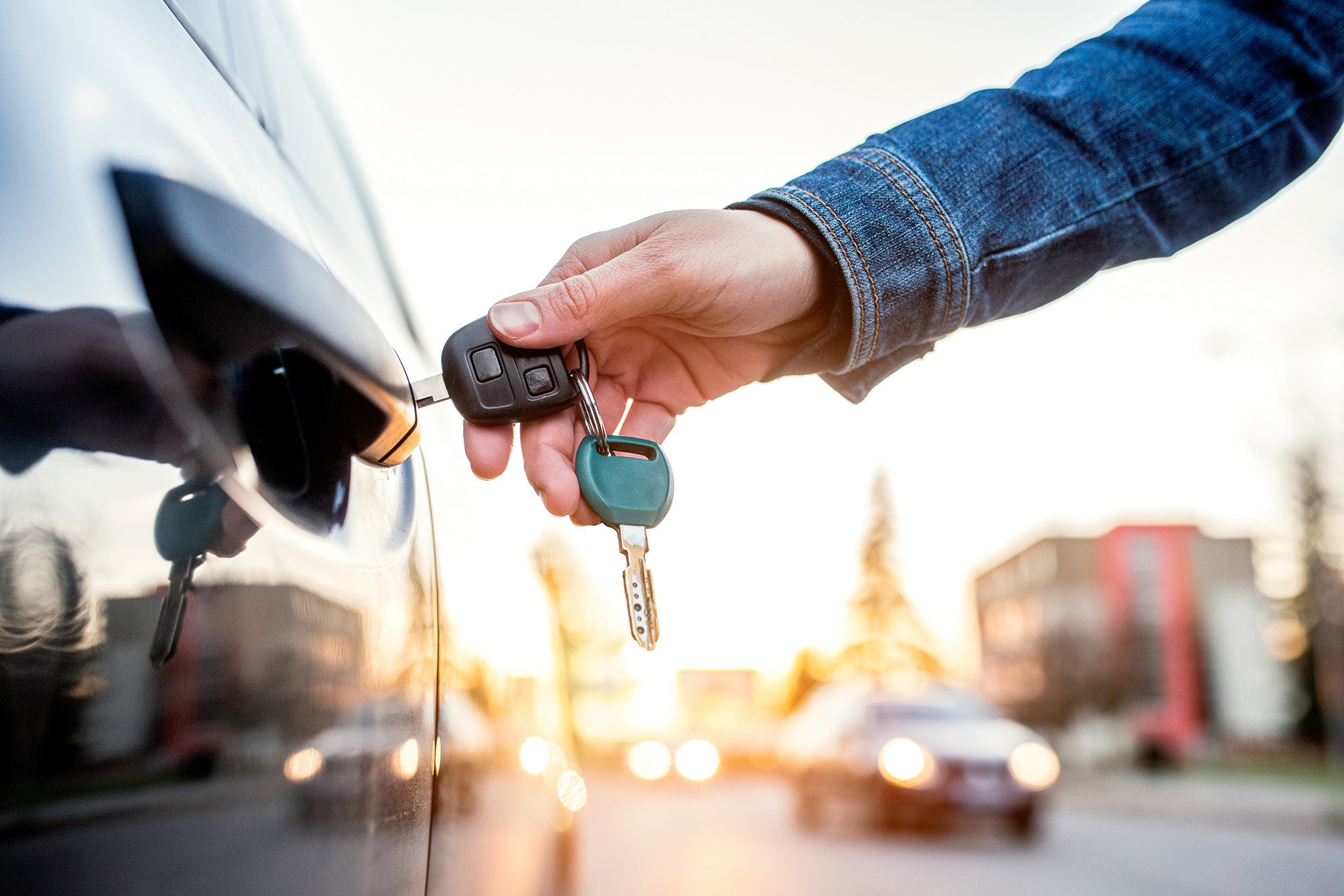 A person unlocking the car